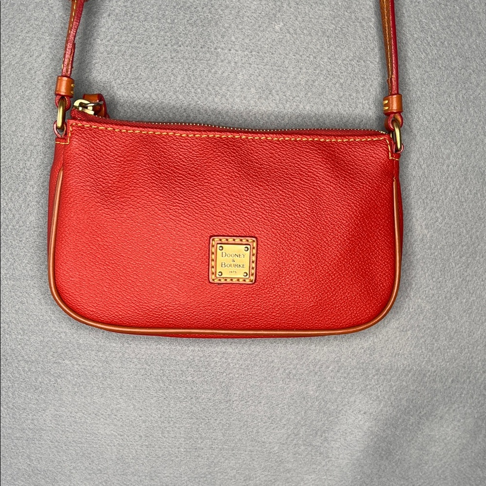 Dooney & Bourke leather Lexi crossbody in tomato red with brown accents